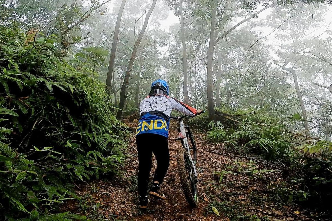 Pushing up through fog on the climb back to the top